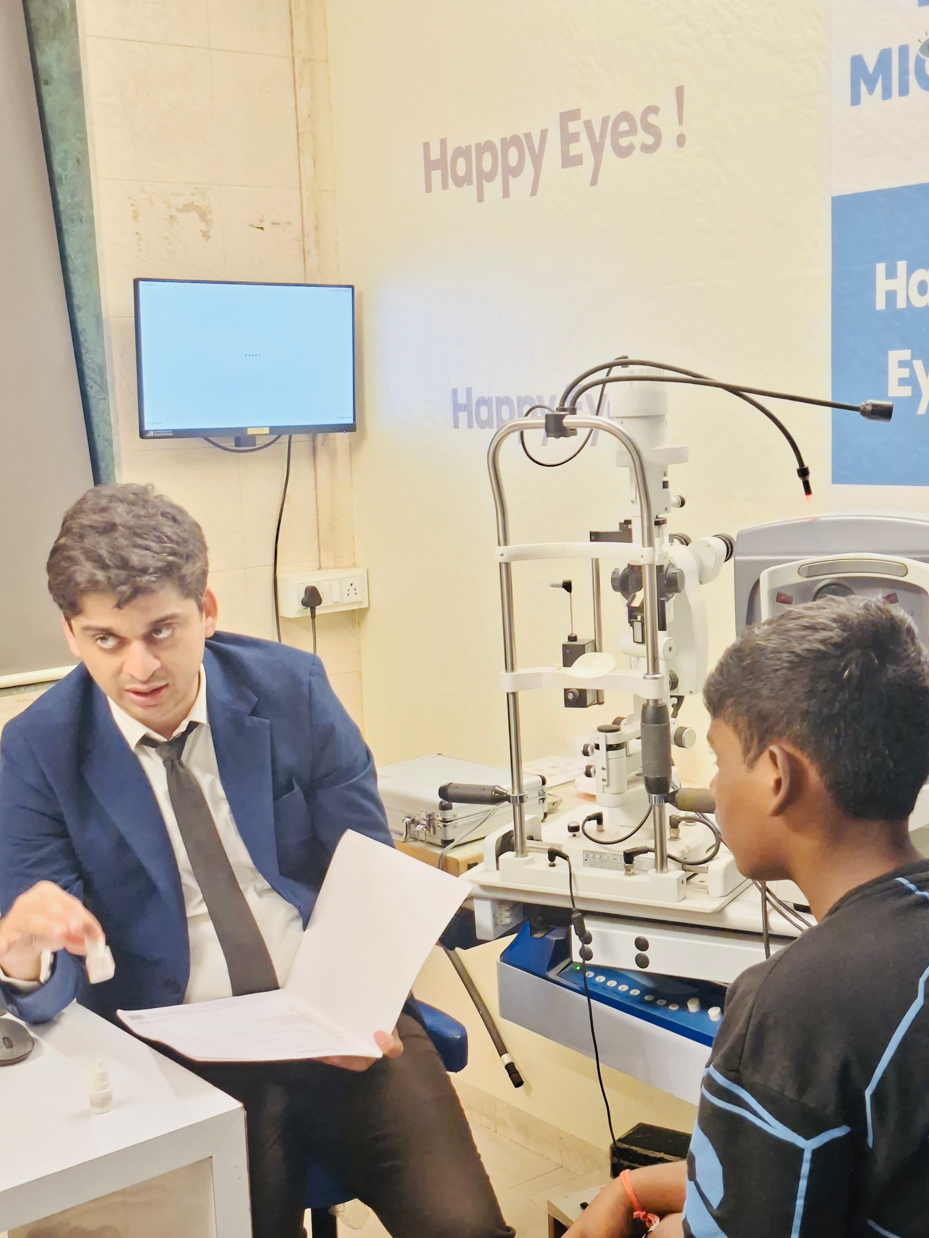 Dr Mickey consulting with a patient